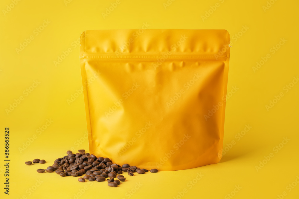 Blank coffee bag on color background