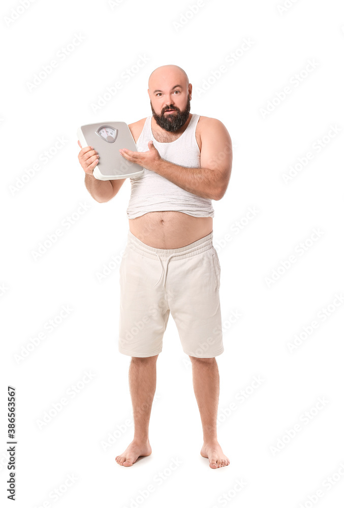 Overweight man with scales on white background. Weight loss concept