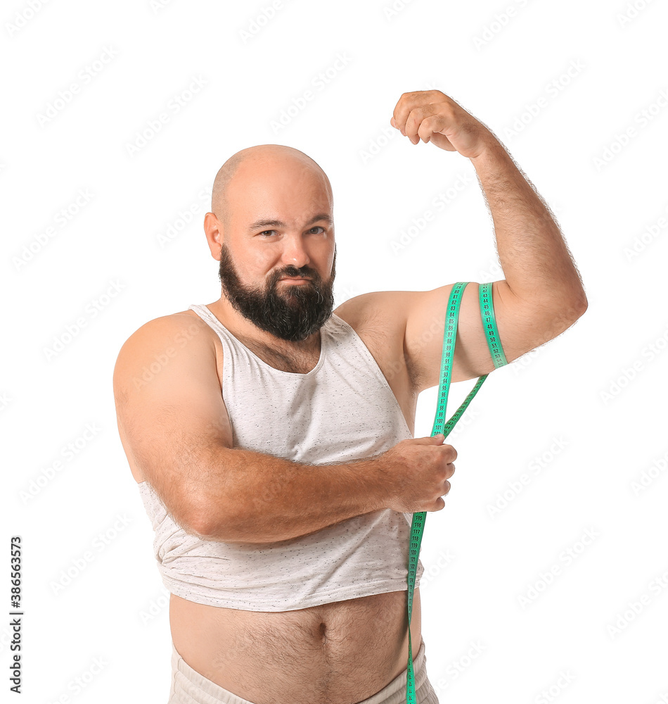 Overweight man with measuring tape on white background. Weight loss concept