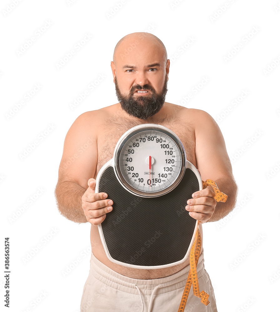 Displeased overweight man with scales on white background. Weight loss concept