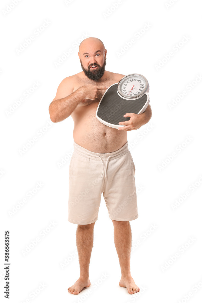 Overweight man with scales on white background. Weight loss concept