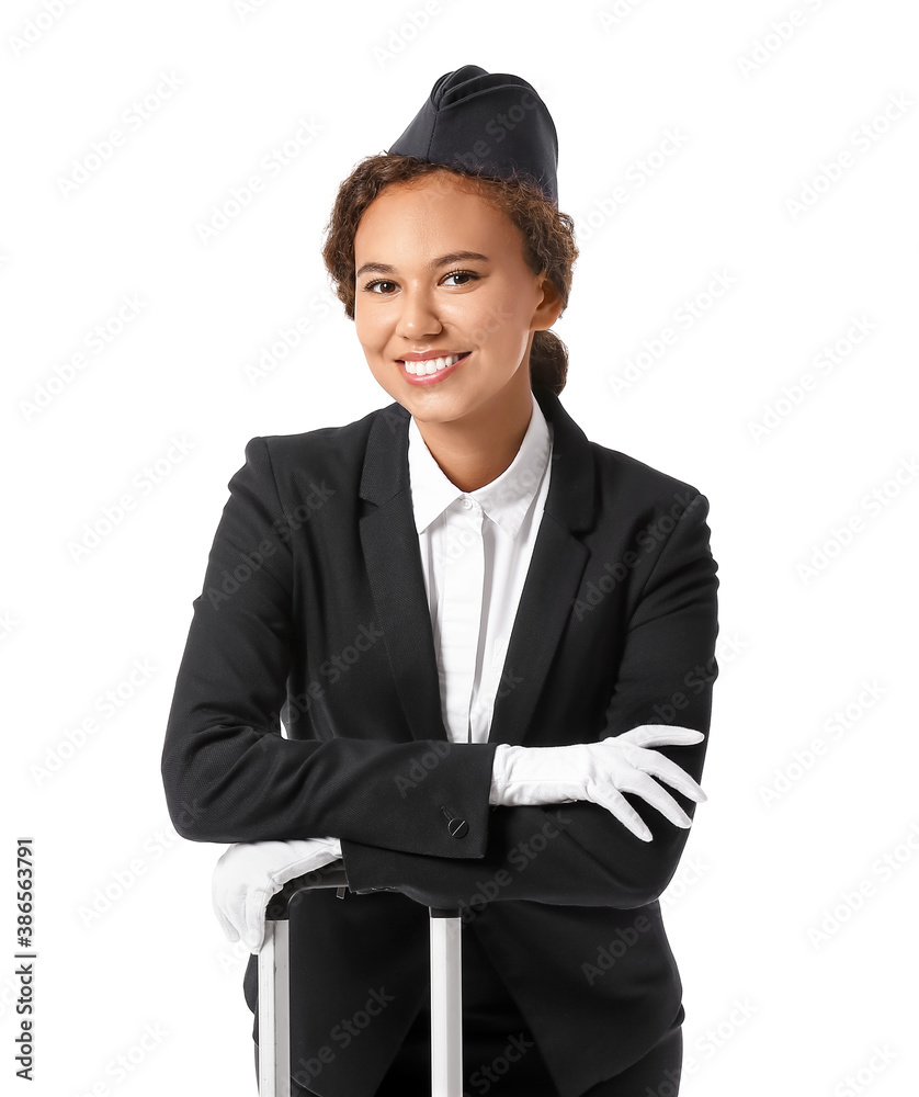 Beautiful African-American stewardess on white background