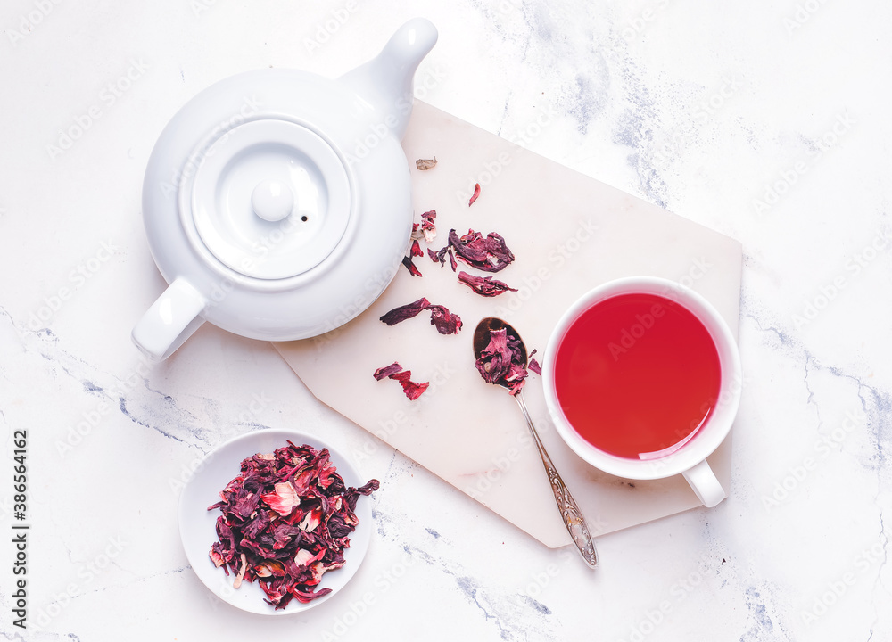 Composition with hot hibiscus tea on table