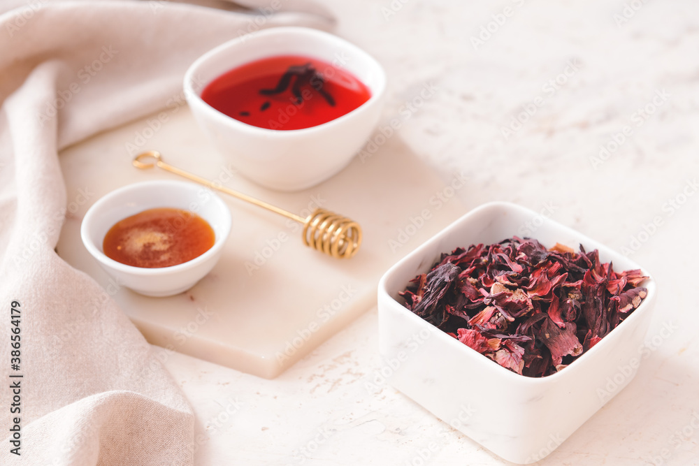 Composition with hibiscus tea on table