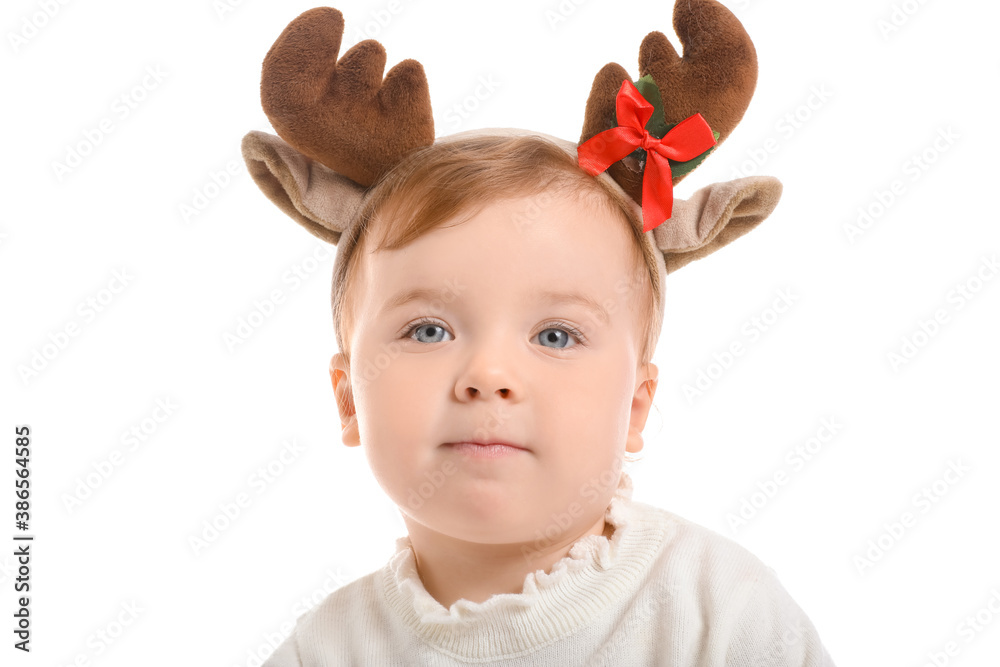 Cute little baby with Christmas deer horns on white background