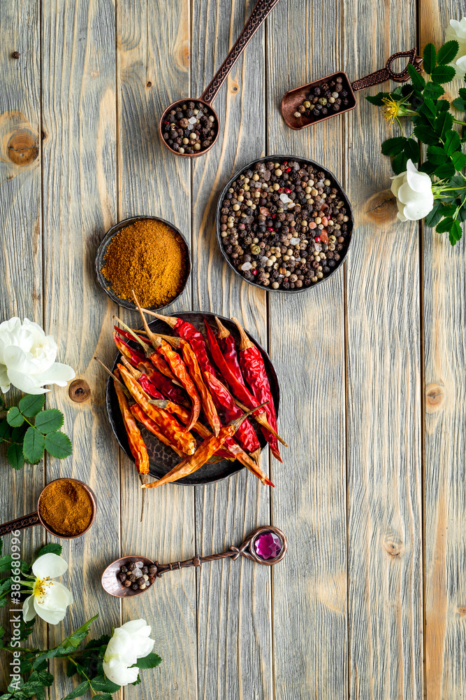 Red hot pepper and paprika - cooking utensils and spices, top view