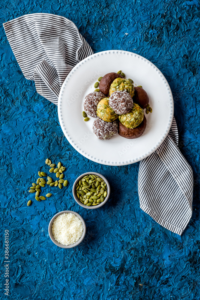 Homemade raw chocolate balls - vegan truffles with cacao and coconut