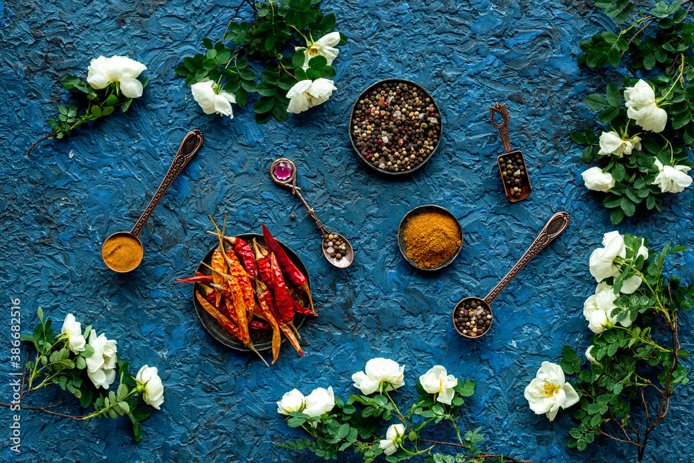 Various aromatic and hot spices with herba and flowers, view from above