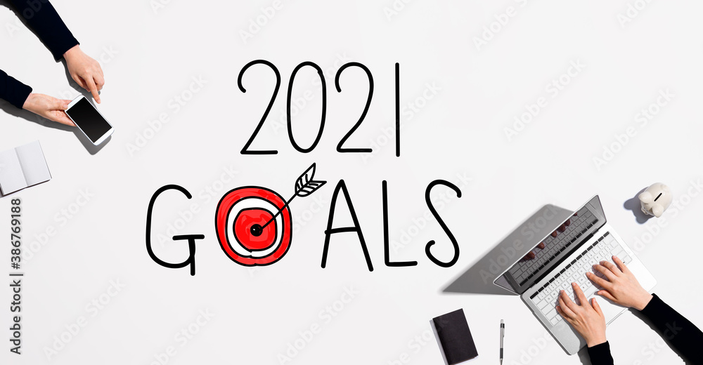 2021 goals concept with people working together with laptop and phone