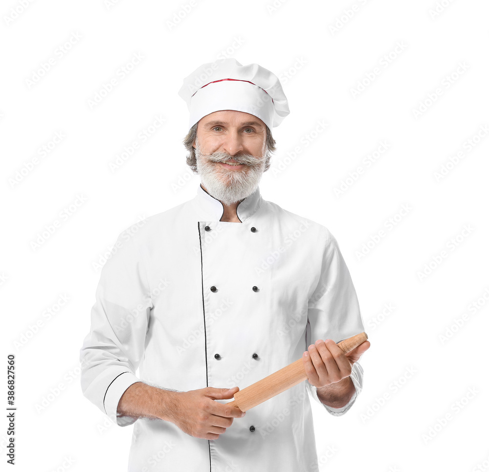 Mature male chef with rolling pin on white background