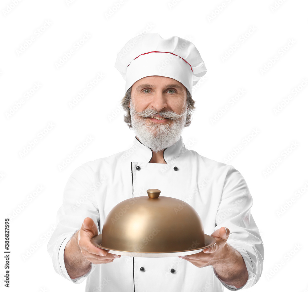 Mature male chef with tray and cloche on white background