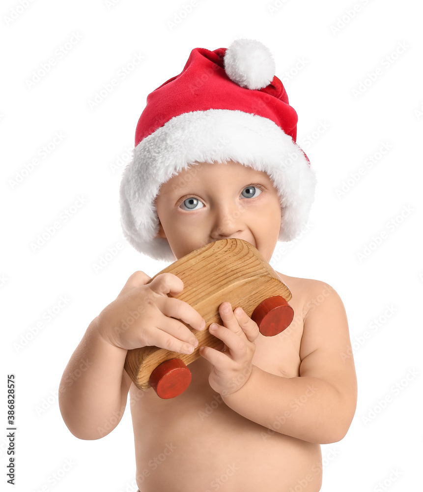 Cute little baby in Santa hat and with toy on white background