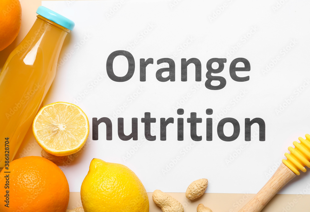 Paper sheet with text ORANGE NUTRITION and fresh products on color background