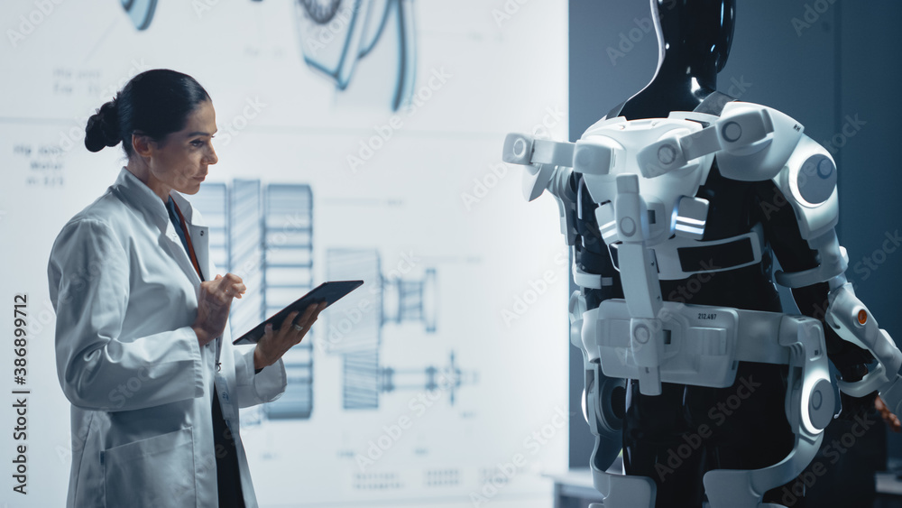 In Robotics Development Laboratory: Chief Female Engineer Works on Bionics Exoskeleton Prototype. Te