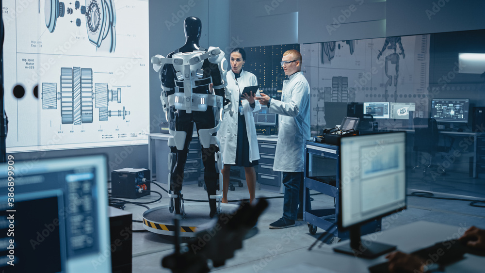 In Robotics Development Laboratory: Chief Female Engineer and Top Male Scientist Work on a Bionics E