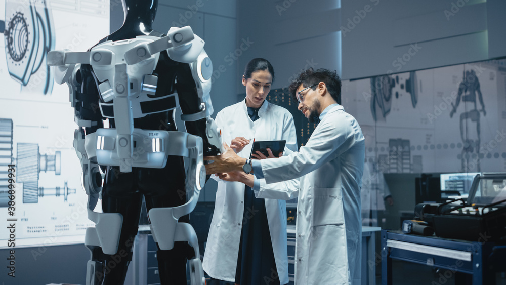 In Robotics Development Laboratory: Chief Female Engineer and Top Male Scientist Work on a Bionics E