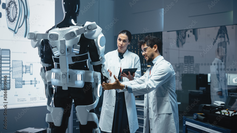 In Robotics Development Laboratory: Chief Female Engineer and Top Male Scientist Work on a Bionics E