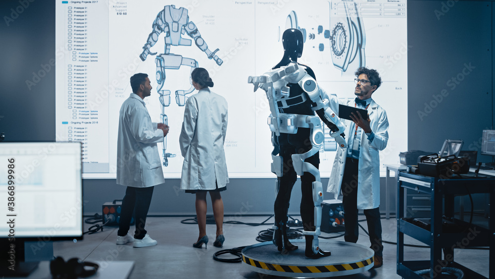 In Robotics Development Laboratory: Female Engineer and Male Scientist Work With Big Screen Showing 