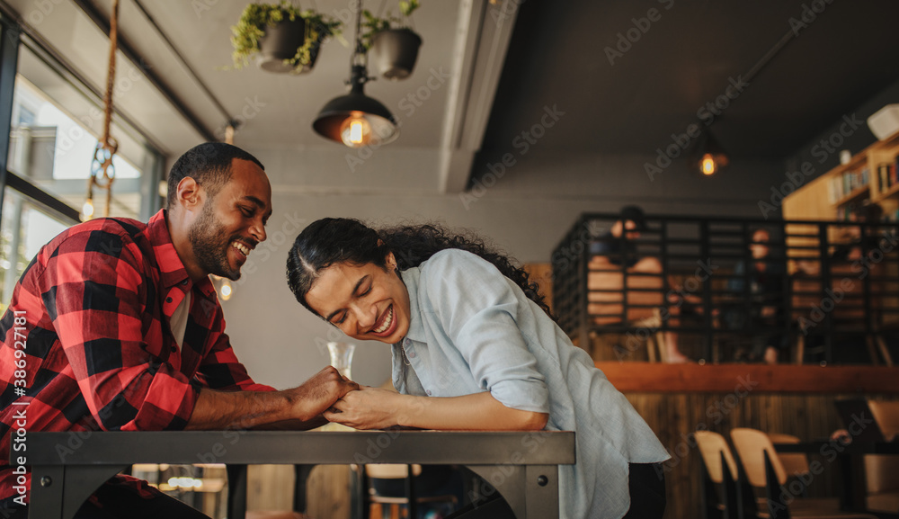 Couple having a great time together at cafe