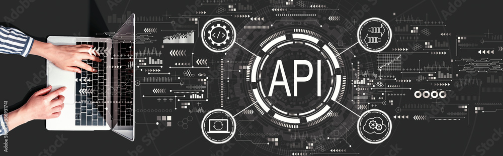 API - application programming interface concept with person using a laptop computer