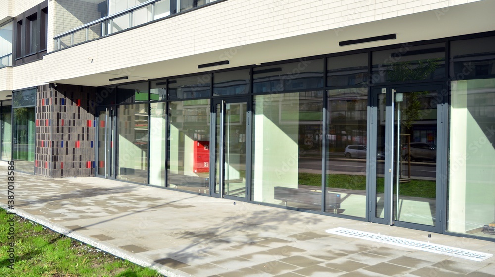 Panoramic windows of new commercial premises. Commercial property in development standard for rent.