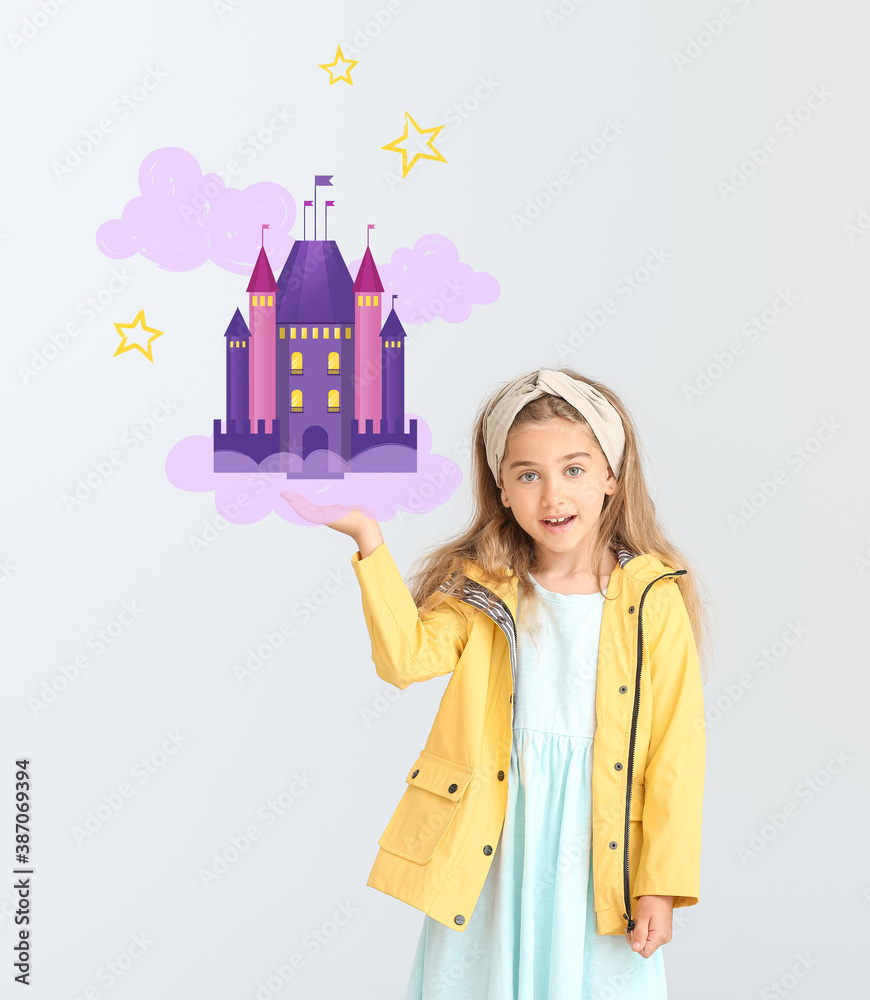 Cute little girl in raincoat on grey background with drawn castle