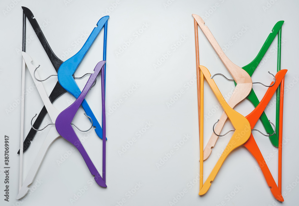 Clothes hangers on light background