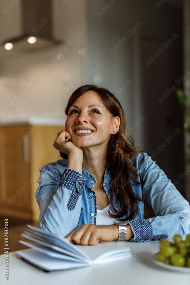 Woman sitting on the floor, thinking about someone.