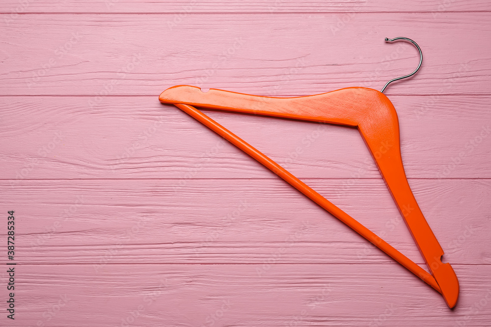 Clothes hanger on wooden  background