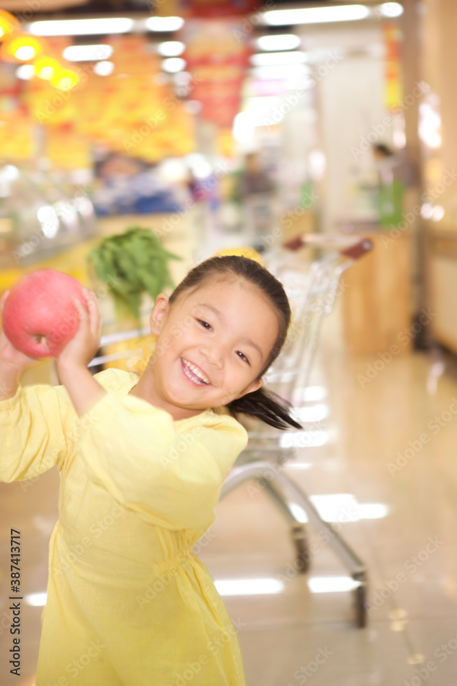 A cute little girl in the supermarket