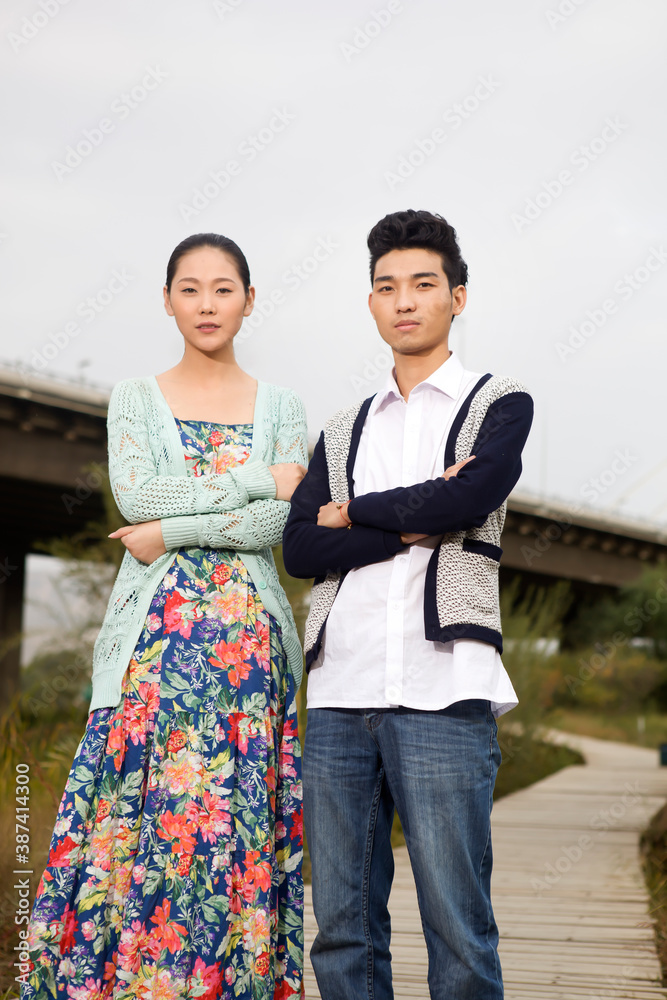 A young couple in the park for an outing