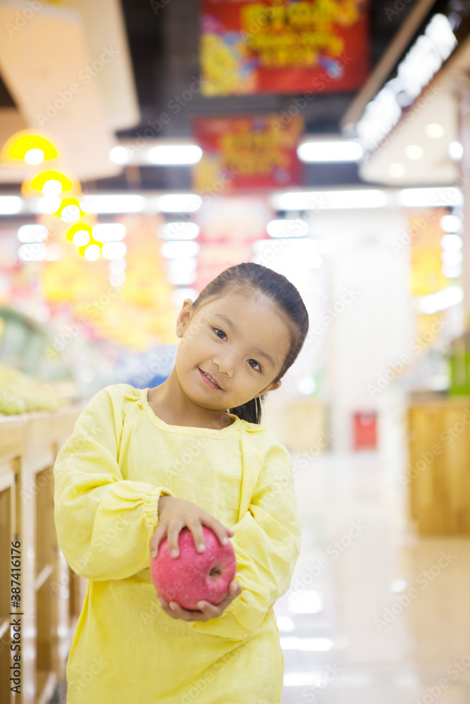 A cute little girl in the supermarket