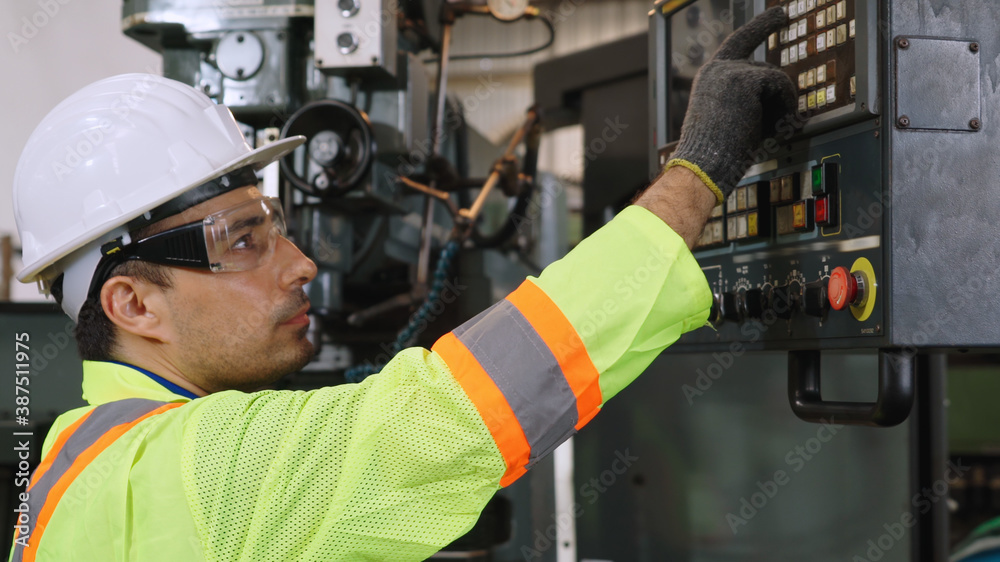 Smart factory worker using machine in factory workshop . Industry and engineering concept.