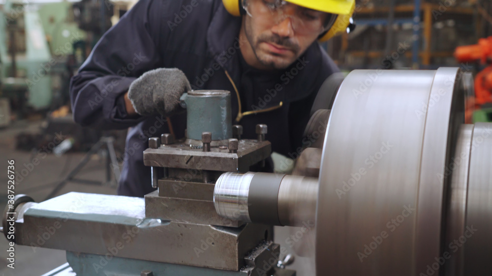 Smart factory worker using machine in factory workshop . Industry and engineering concept.