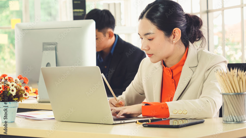 Business people working at table in modern office room while analyzing financial data report .