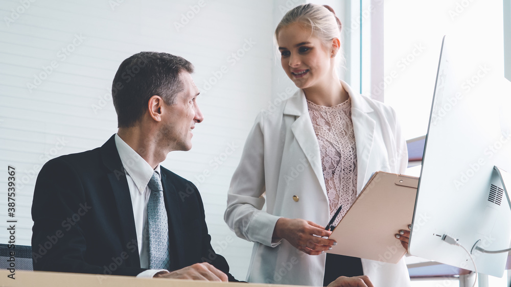 Two business people talk project strategy at office meeting room. Businessman discuss project planni