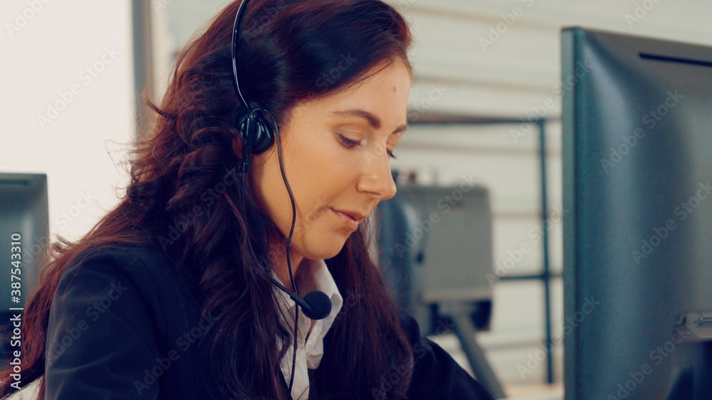 Business people wearing headset working in office to support remote customer or colleague. Call cent