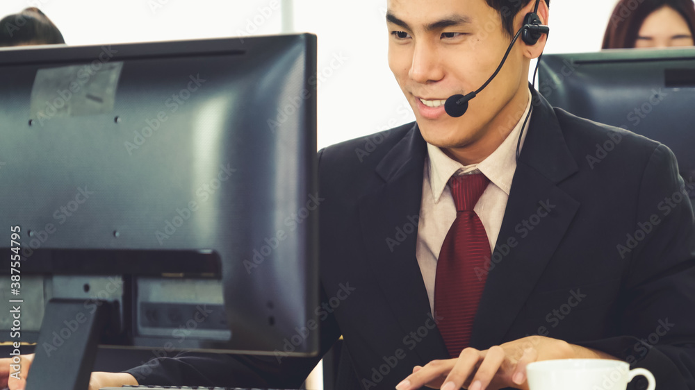 Business people wearing headset working in office to support remote customer or colleague. Call cent