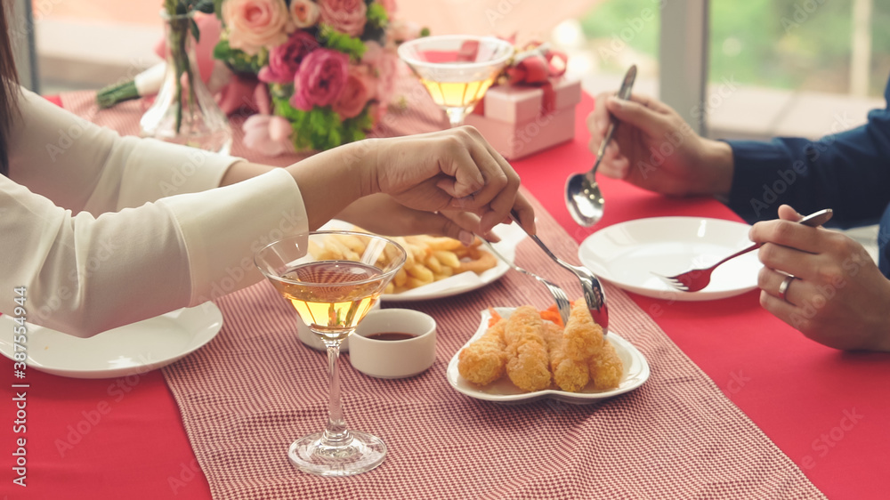 Happy romantic couple eating lunch at restaurant . Couple anniversary celebration and lifestyle .