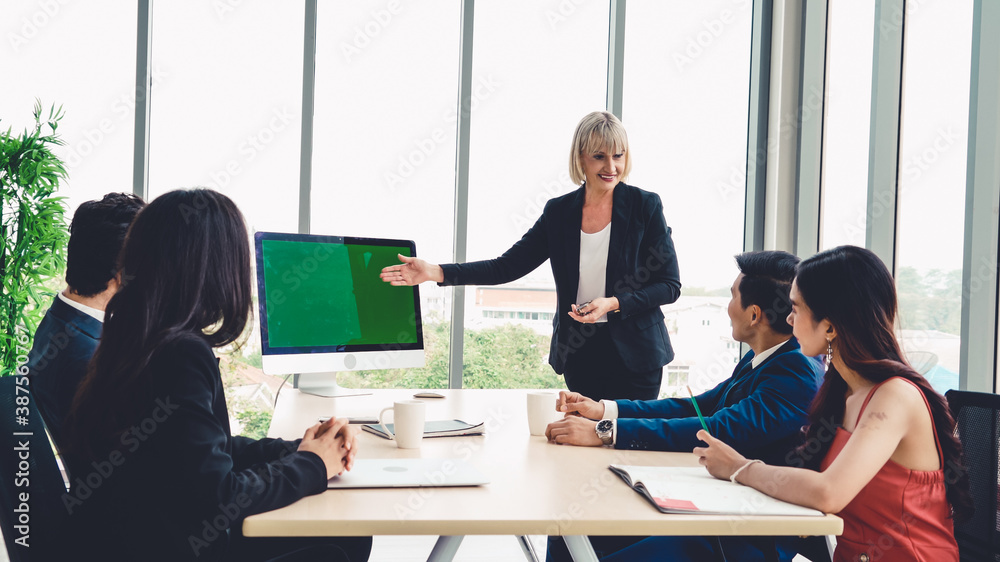 Business people in the conference room with green screen chroma key TV or computer on the office tab