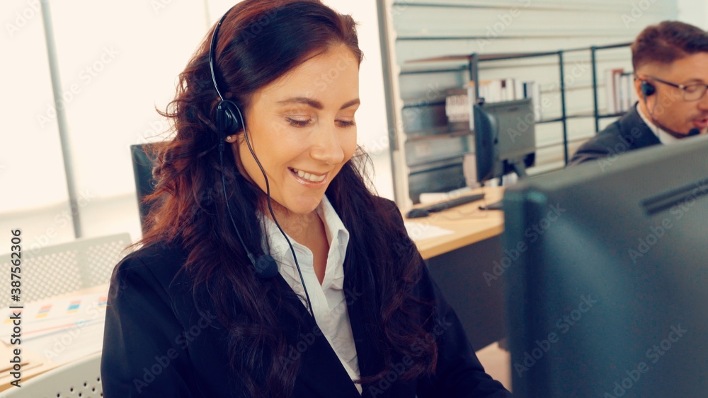 Business people wearing headset working in office to support remote customer or colleague. Call cent