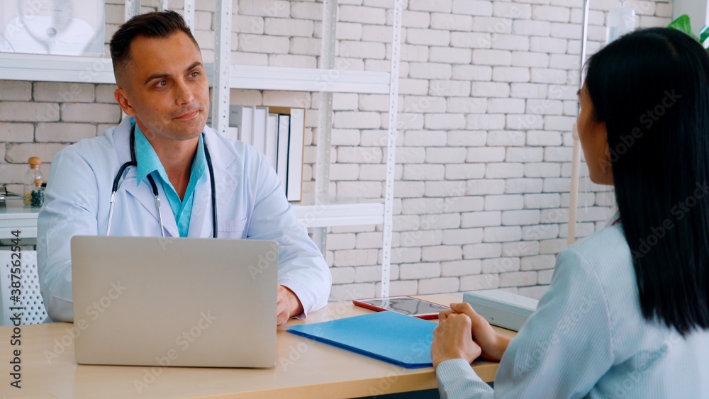 Doctor in professional uniform examining patient at hospital or medical clinic. Health care , medica