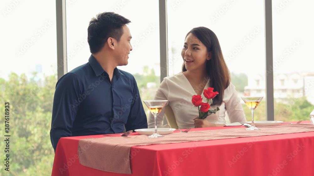 Happy romantic couple eating lunch at restaurant . Couple anniversary celebration and lifestyle .