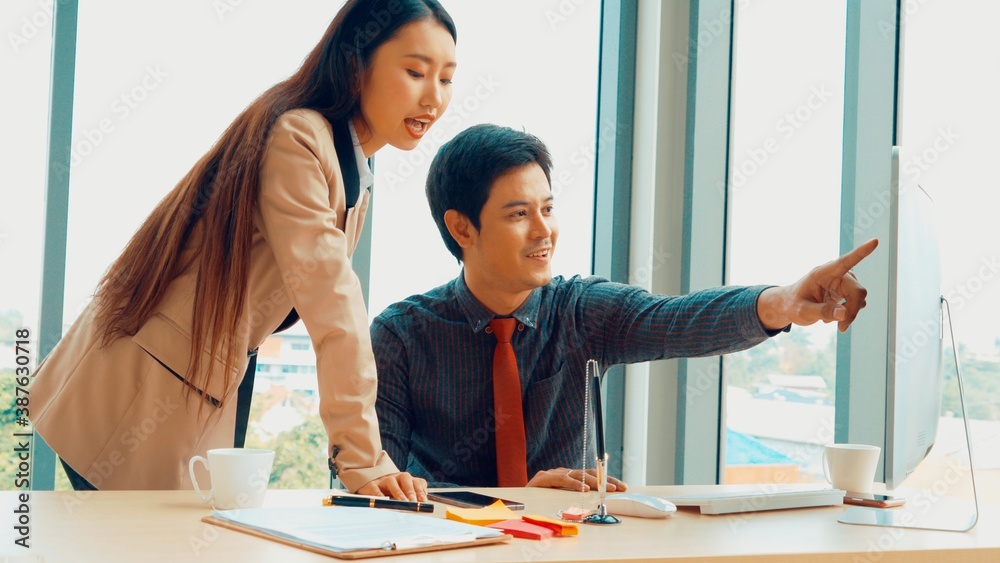 Two business people talk project strategy at office meeting room. Businessman discuss project planni