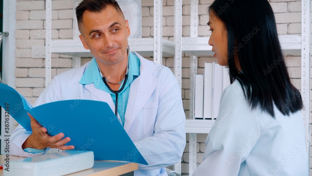 Doctor in professional uniform examining patient at hospital or medical clinic. Health care , medica