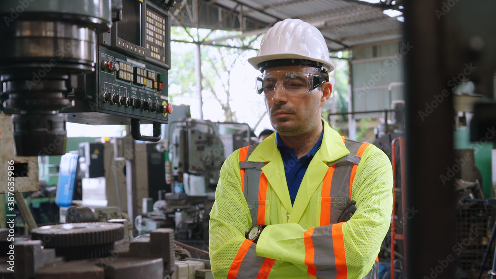 Smart factory worker using machine in factory workshop . Industry and engineering concept.