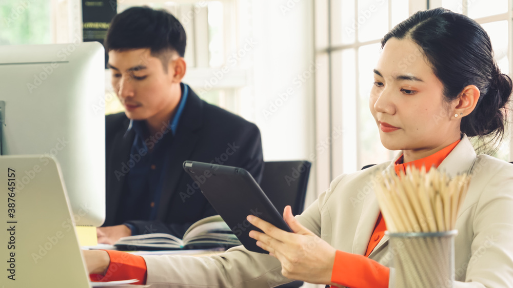 Business people working at table in modern office room while analyzing financial data report .