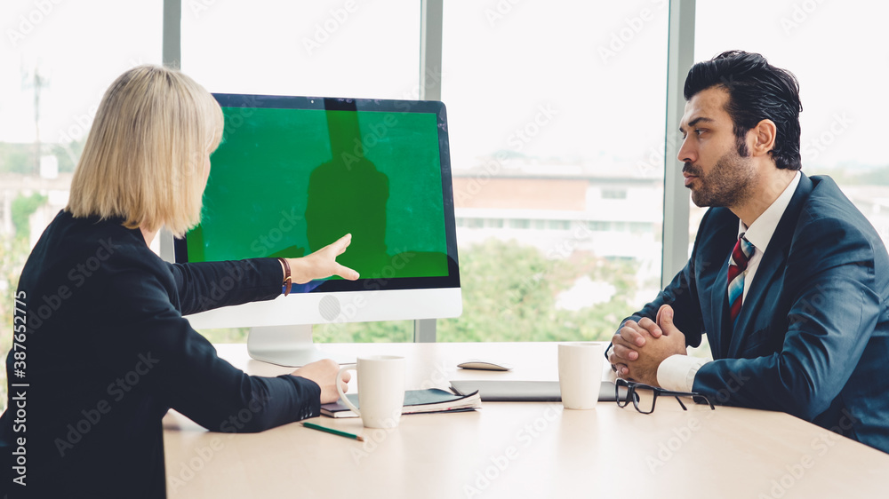 Business people in the conference room with green screen chroma key TV or computer on the office tab