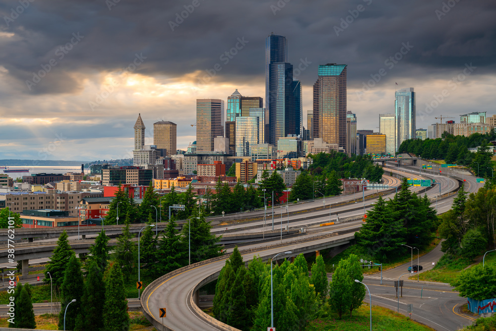 Seattle, Washington, USA downtown skyline and highways at dusk.