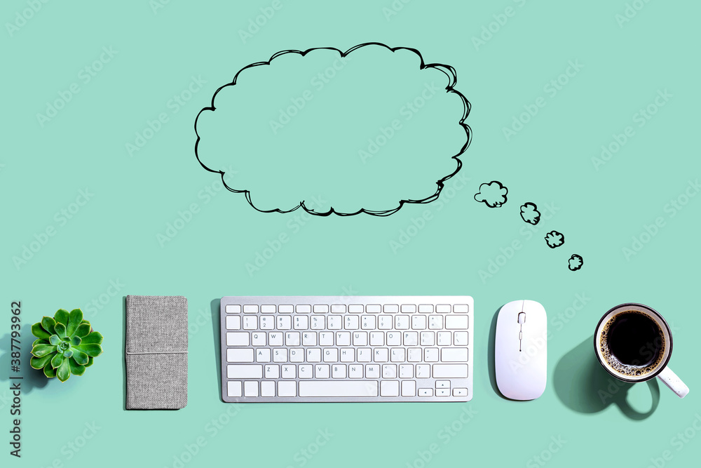 Blank speech bubble with a computer keyboard and a mouse